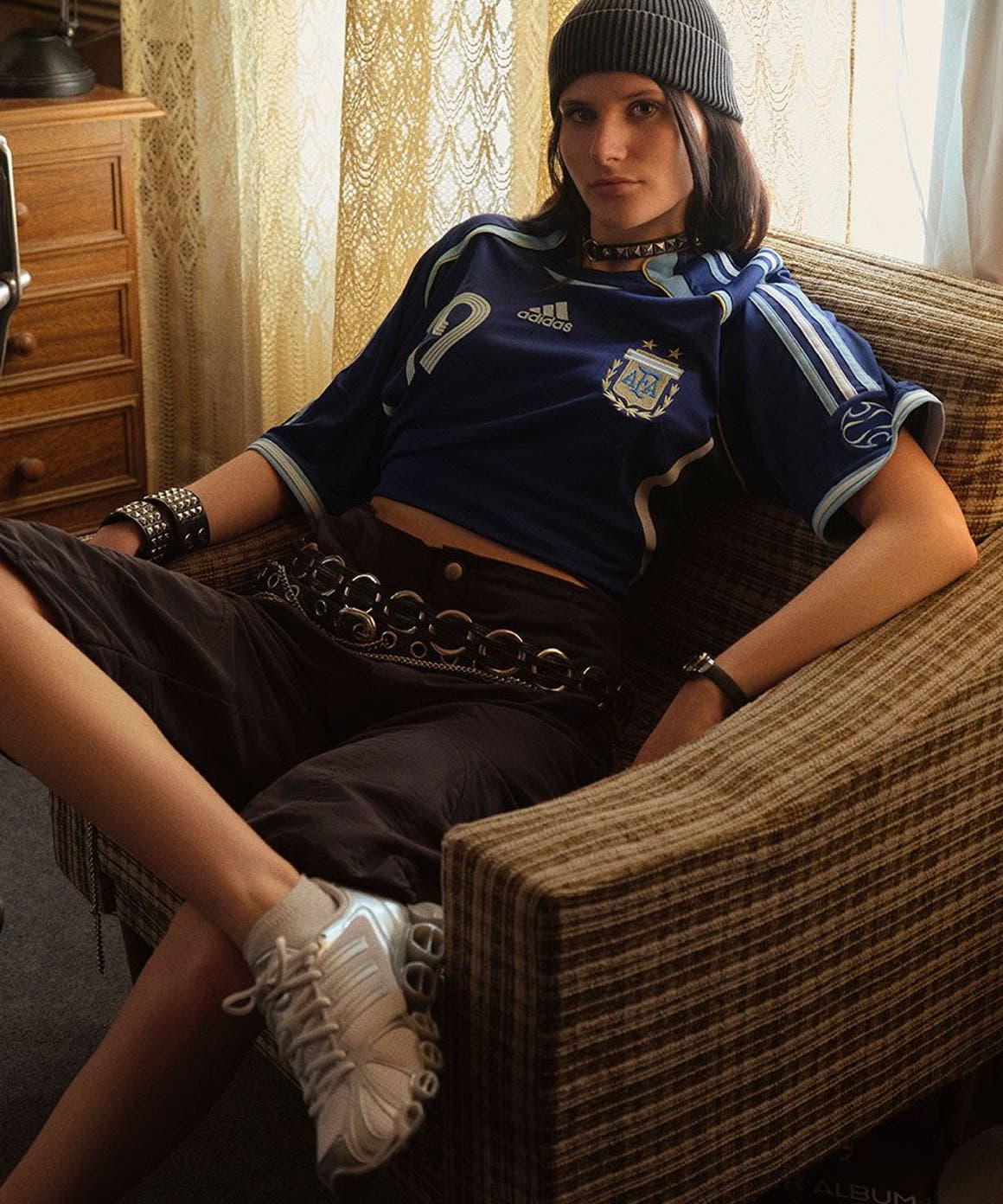 Woman sitting in chair.