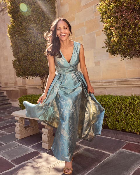 Women wearing teal mother of the bride long dress.