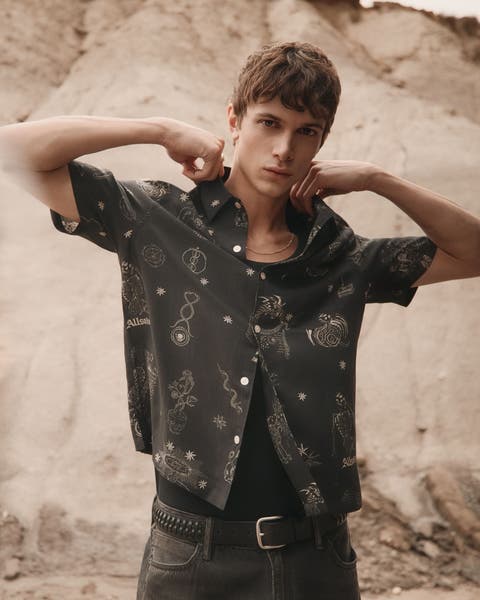 Man wearing AllSaints button up.