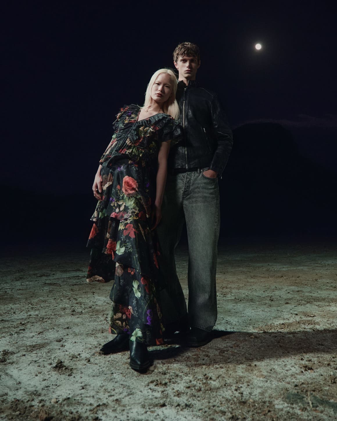 A woman and man in the AllSaints spring collection.