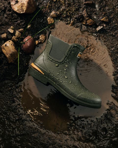 Barbour booties laying in puddle in the dirt