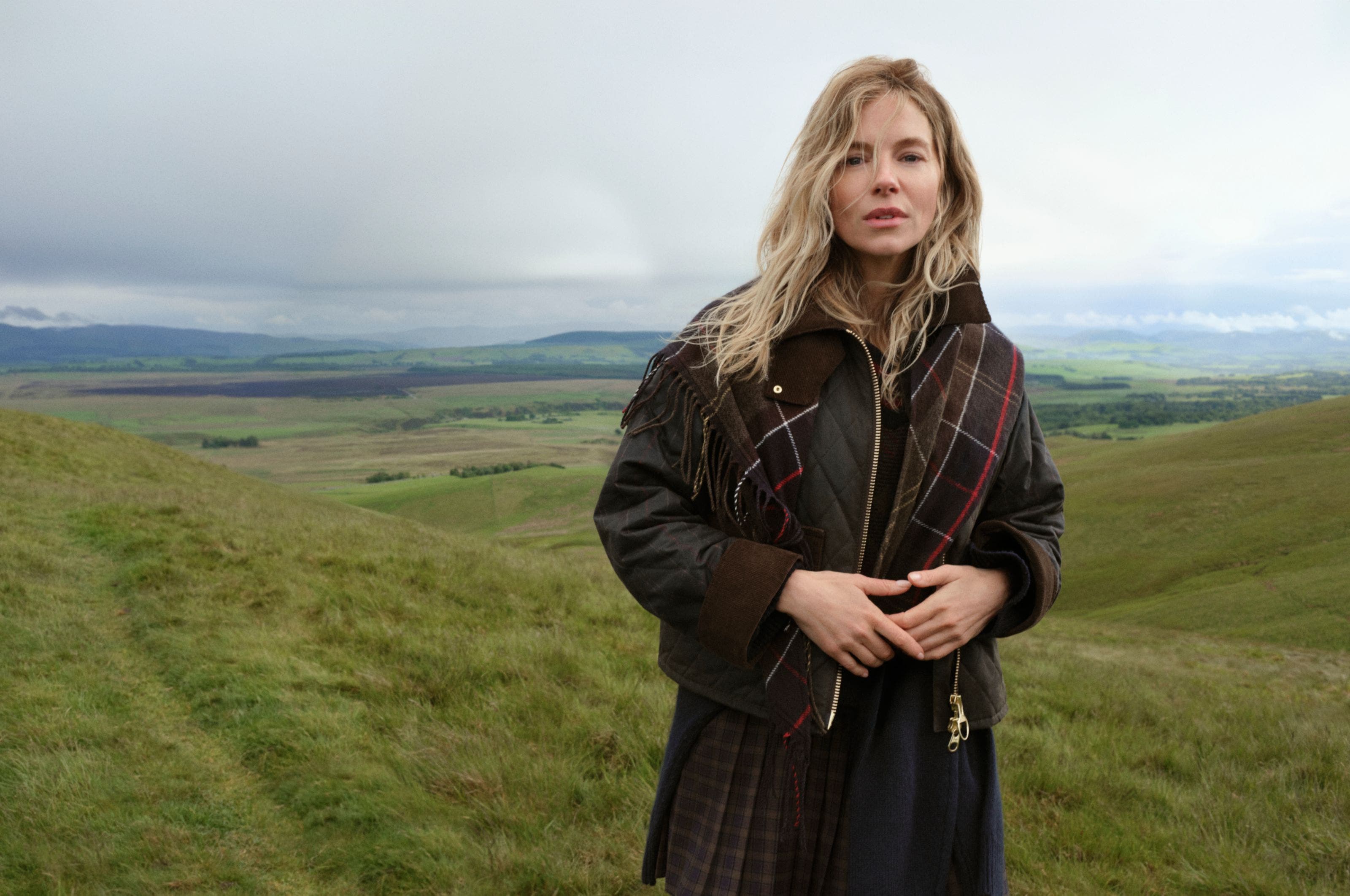 Sienna Miller in a plaid Barbour Jacket.