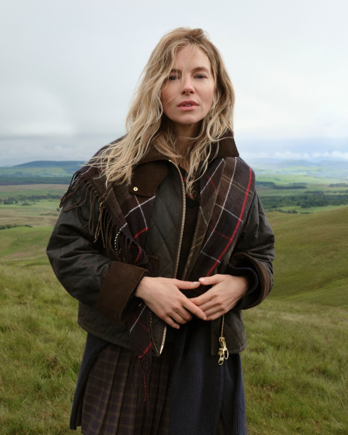 Sienna Miller in a plaid Barbour Jacket.