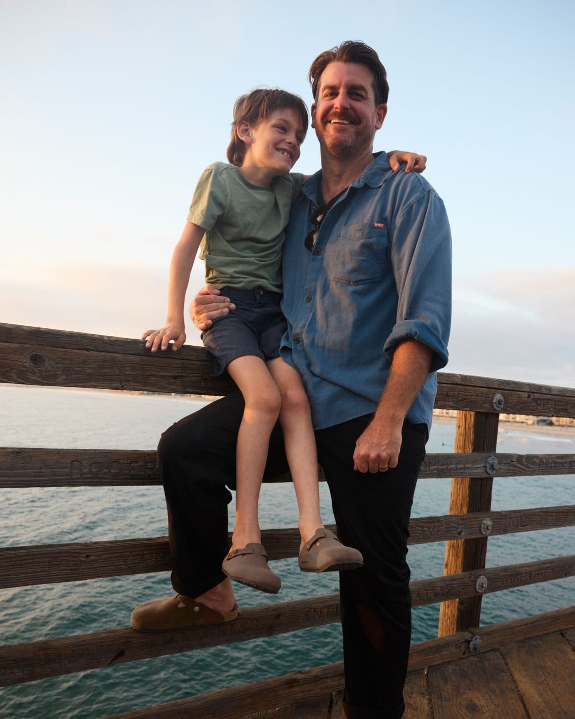 A man and son wearing Birkenstocks.