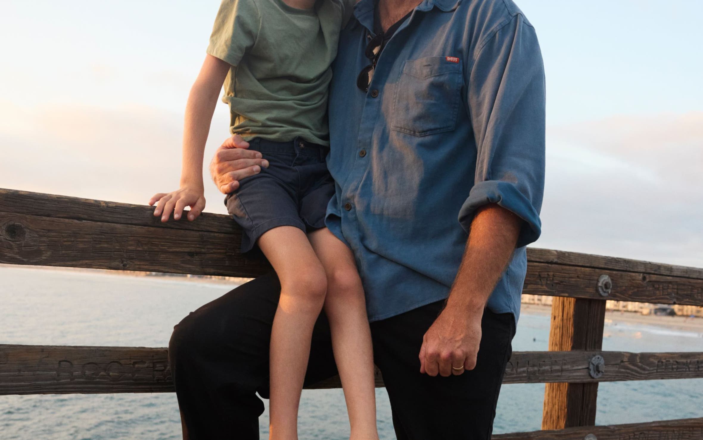 A man and child wear birkenstock sandals.