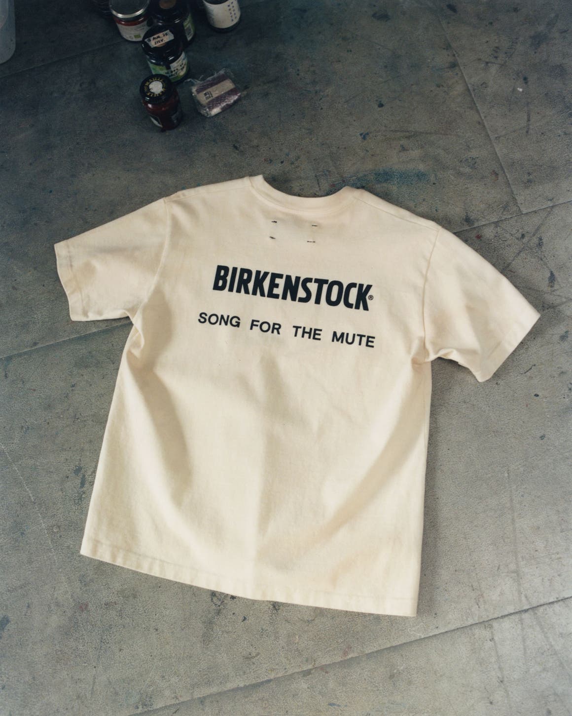 Birkenstock and Song for the Mute collaboration t-shirt.
