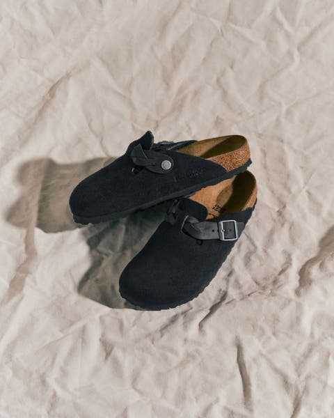 A pair of black Birkenstock clogs.
