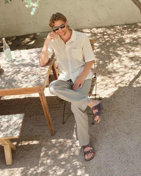 Man wearing Birkenstocks.