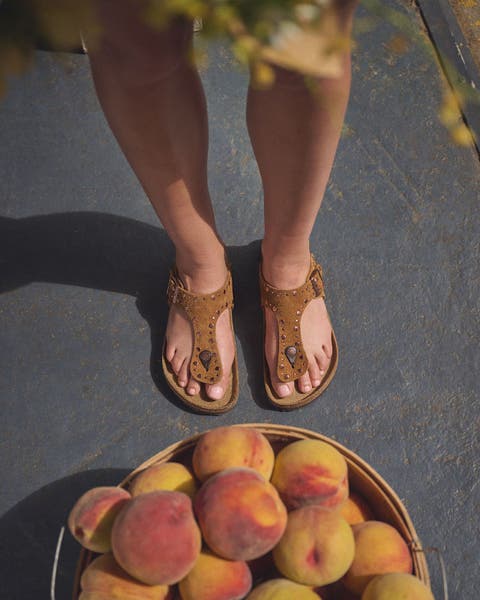 Woman wearing Birkenstock sandals.