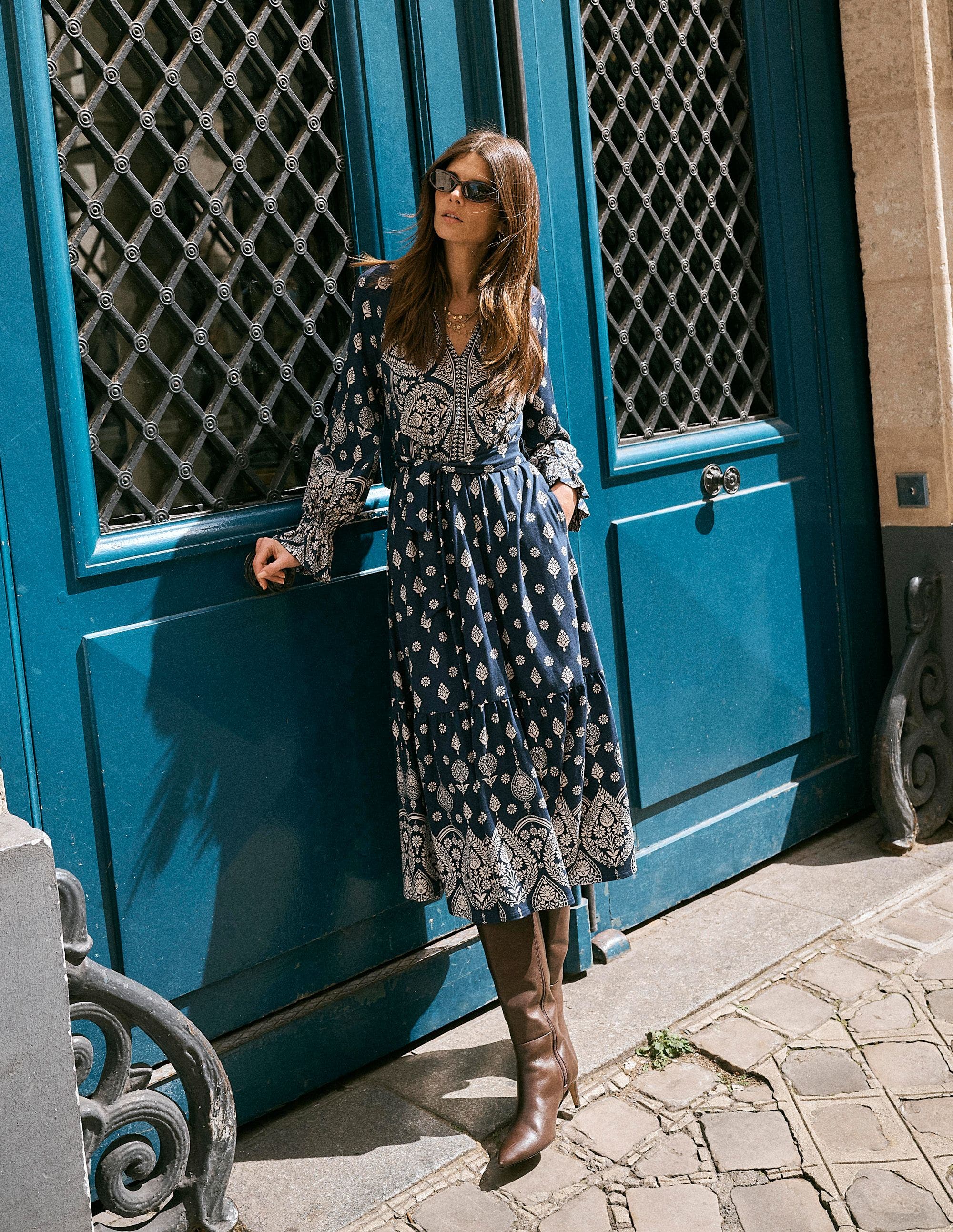 A woman in a printed midi dress.