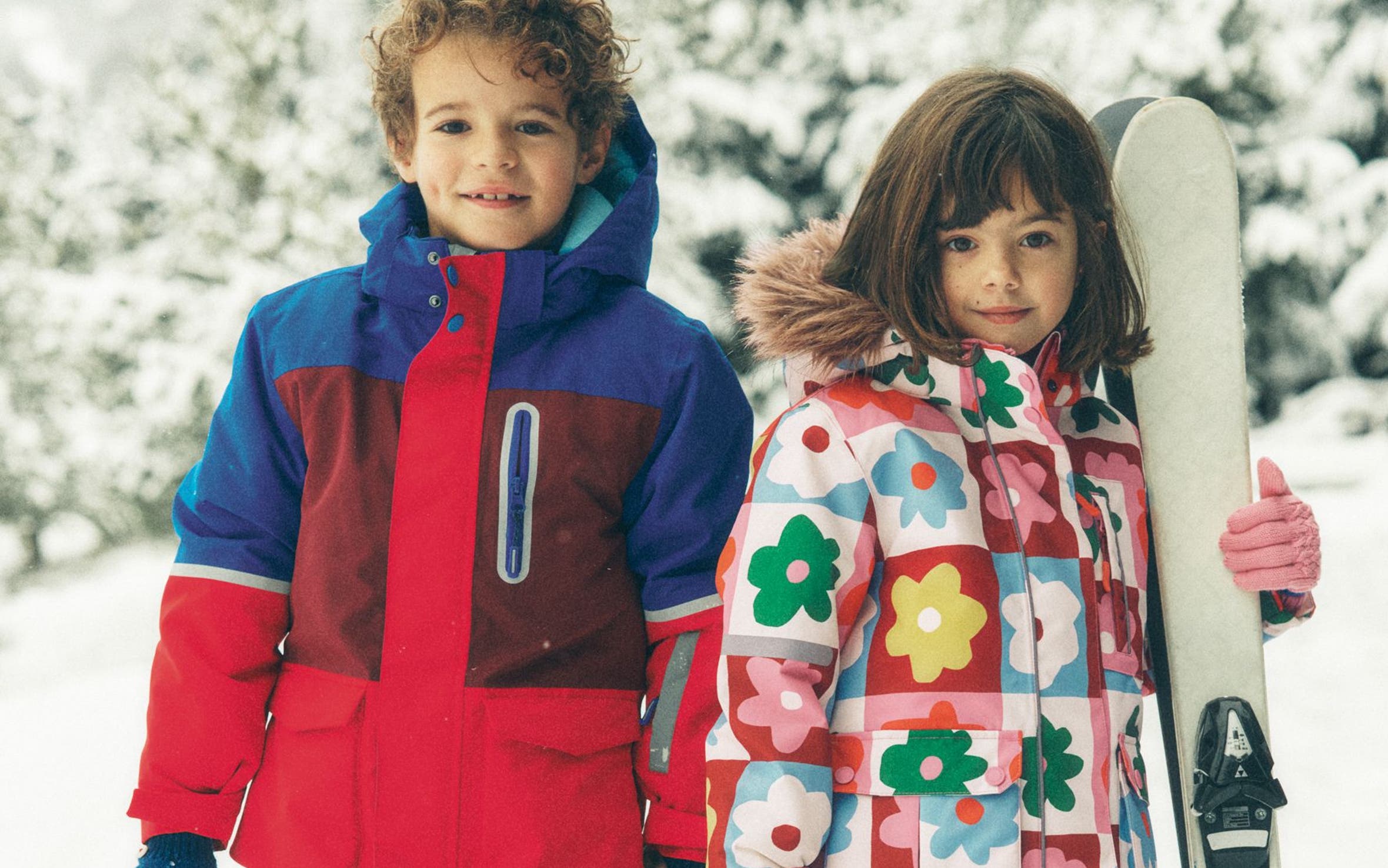 A little boy and little girl wearing outerwear from Mini Boden.