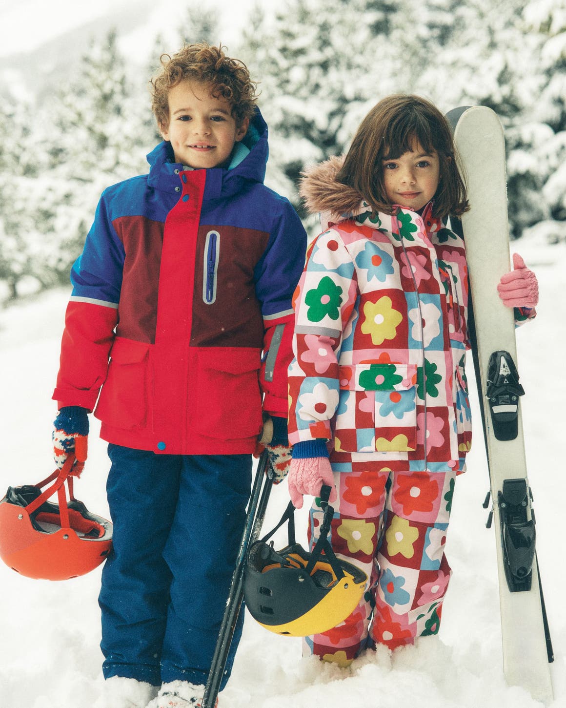A little boy and little girl wearing outerwear from Mini Boden.