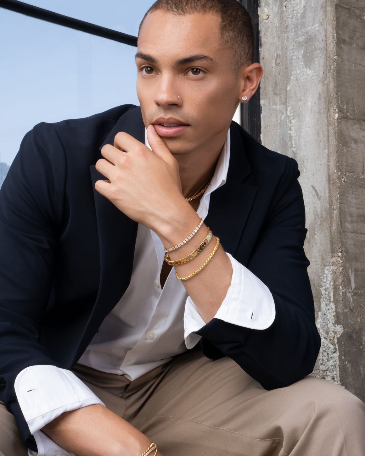 A man wearing several Bony Levy bracelets.