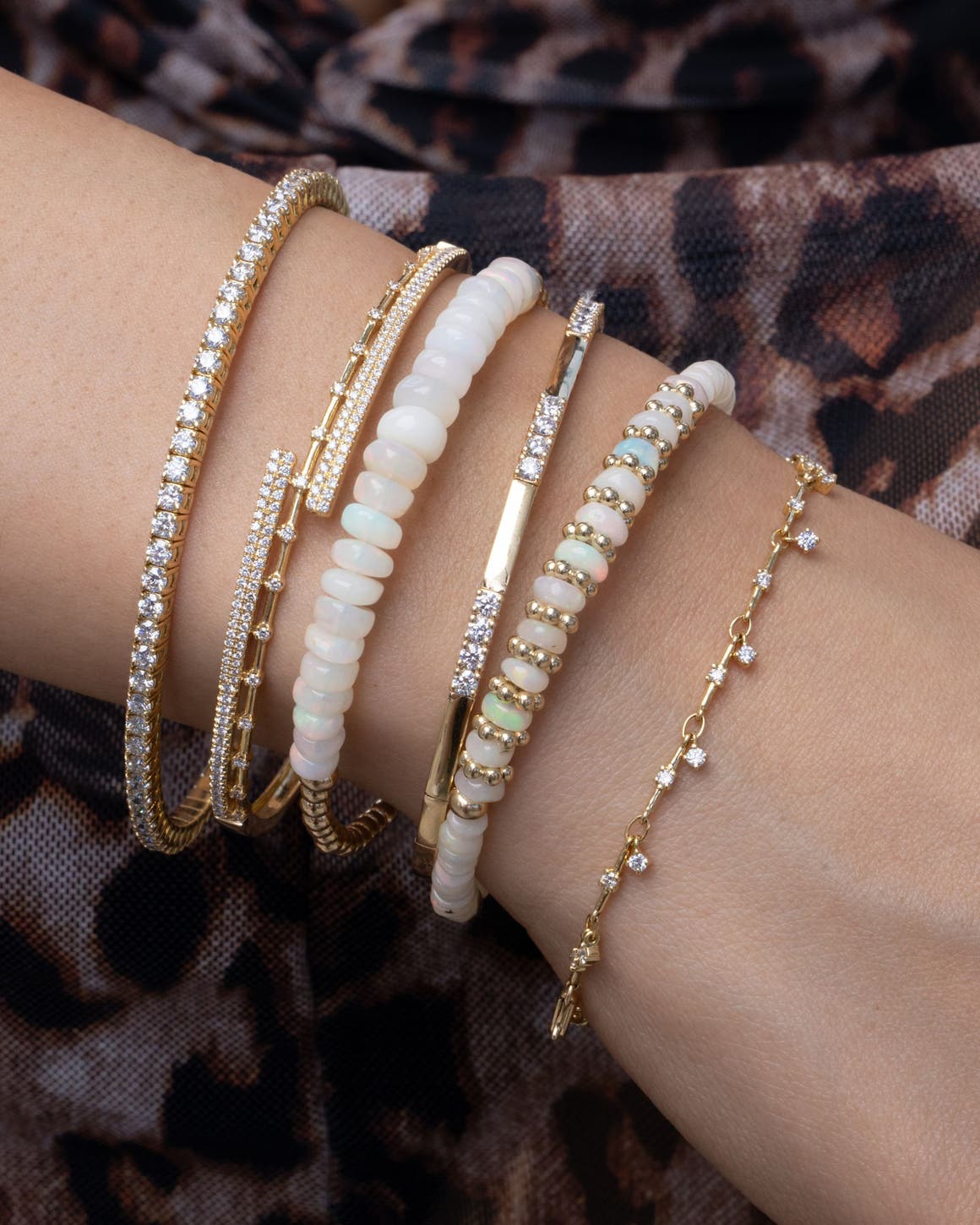 A woman wearing several bracelets.