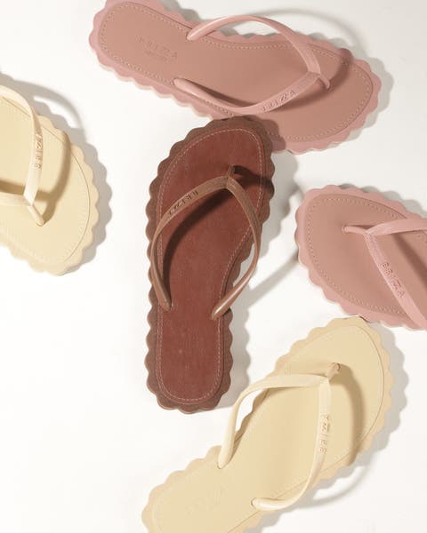 scalloped brown, pink and sand colored flip flops
