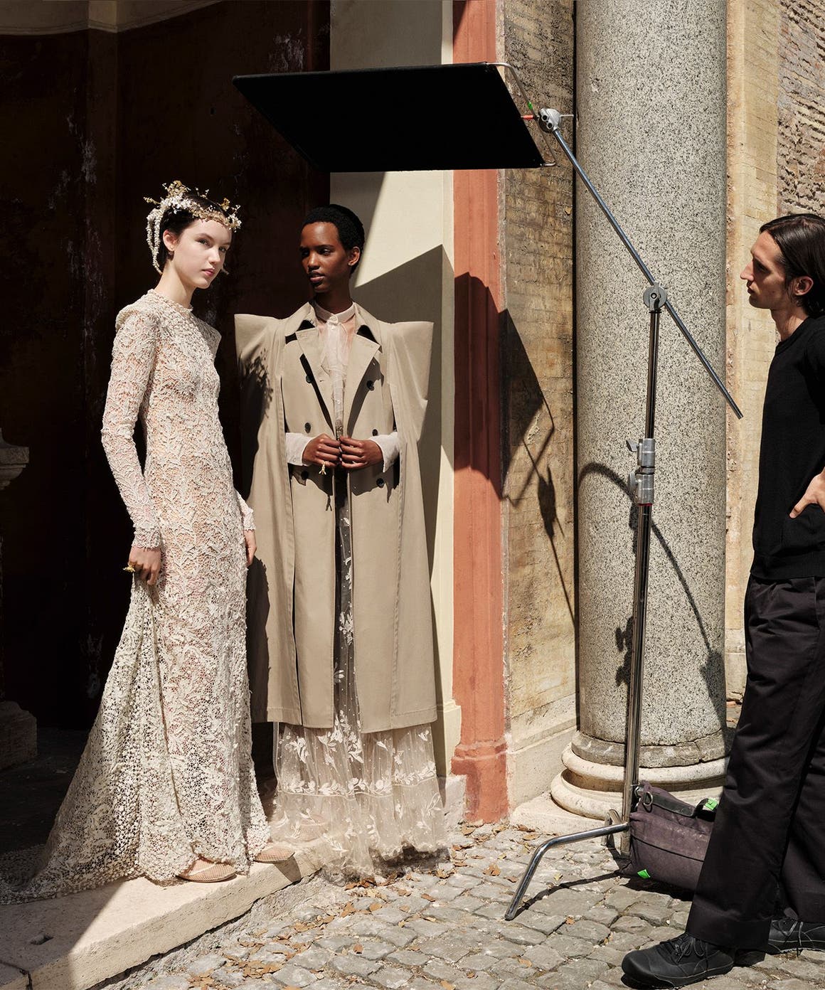 Two women and man wearing DIOR.