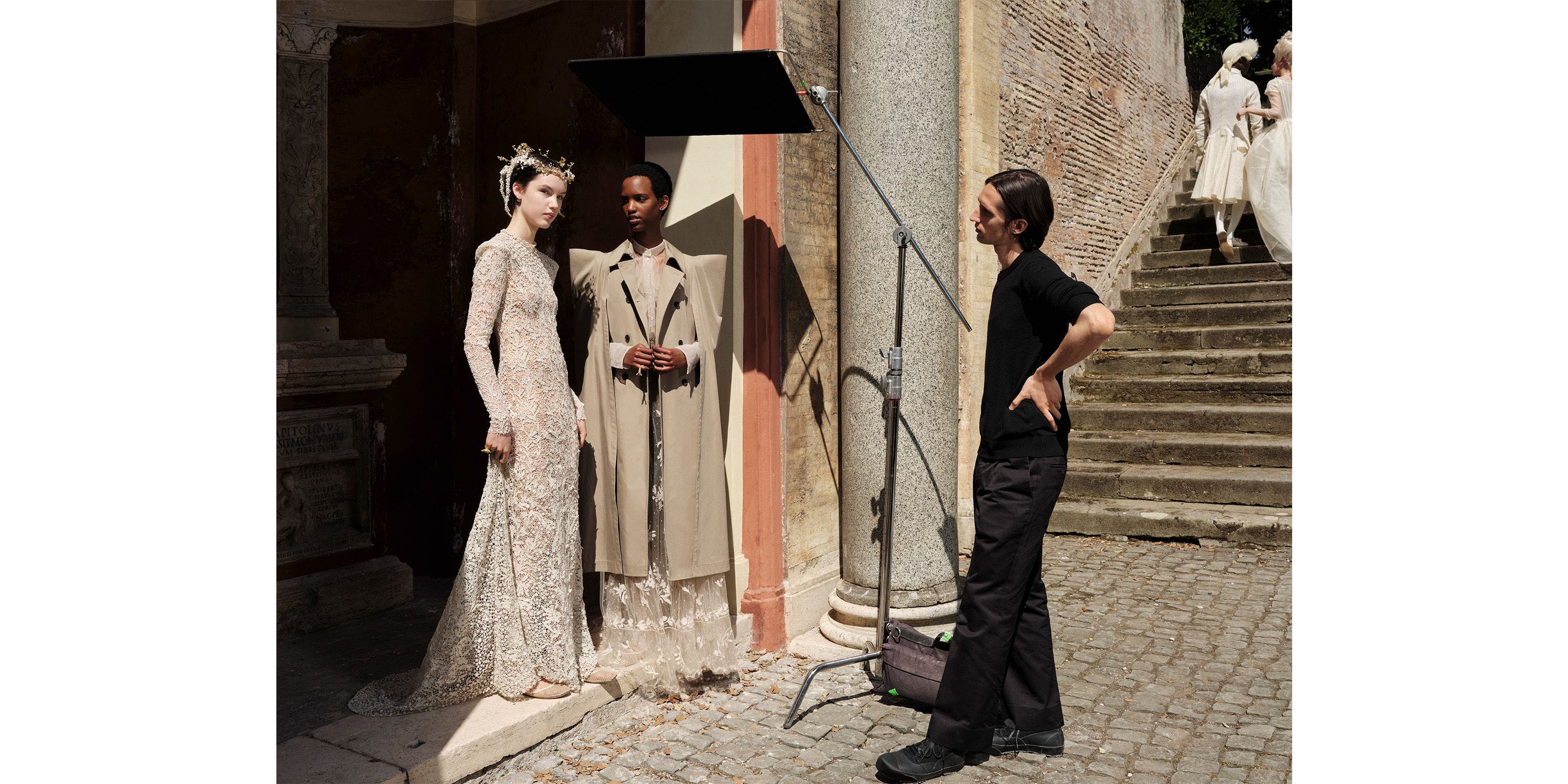 Two women and man wearing DIOR.