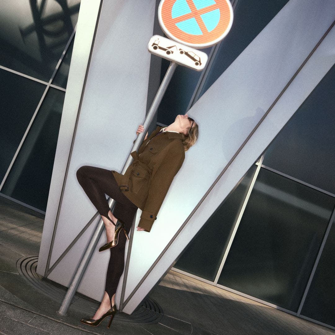 A woman wearing metallic Christian Louboutin high heels.