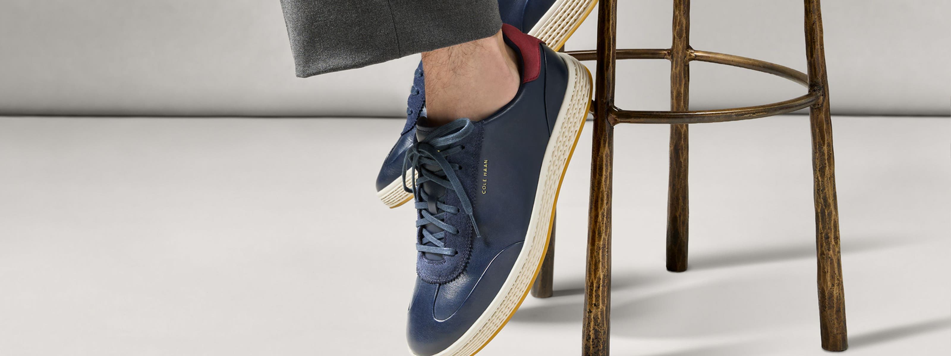 Man wearing Cole Haan sneakers.