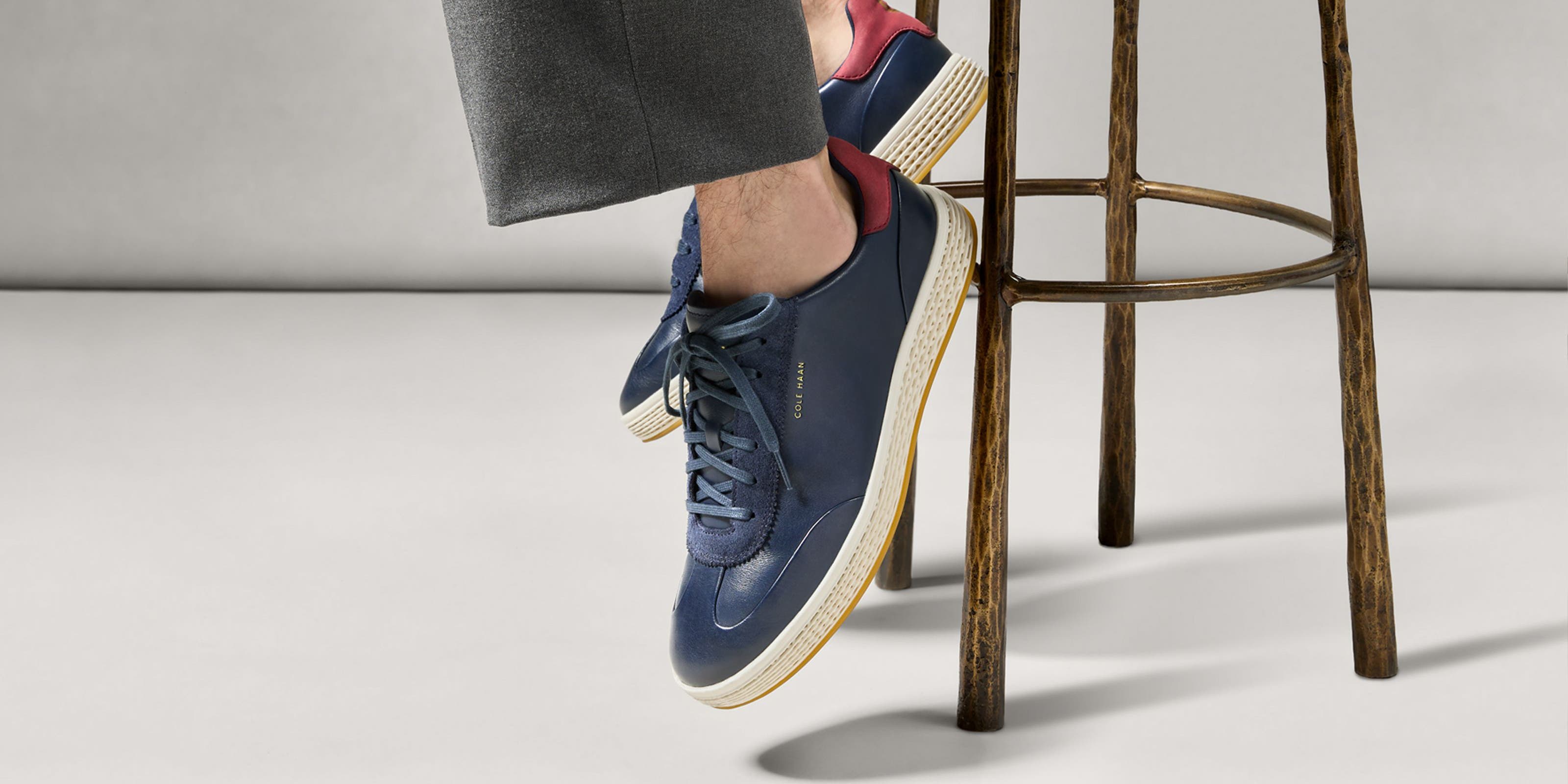 Man wearing Cole Haan sneakers.