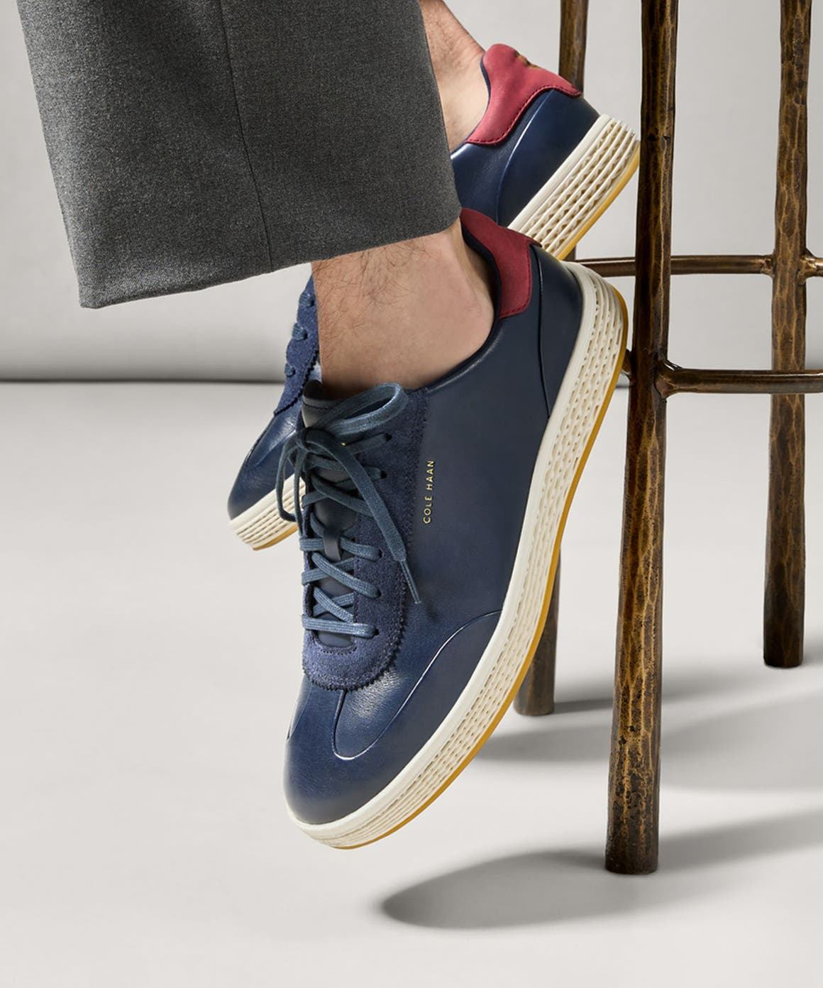 Man wearing Cole Haan sneakers.