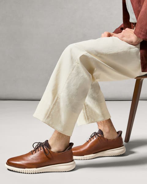 Brown Men's Cole Haan oxfords.