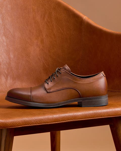 Brown Men's Cole Haan oxfords.