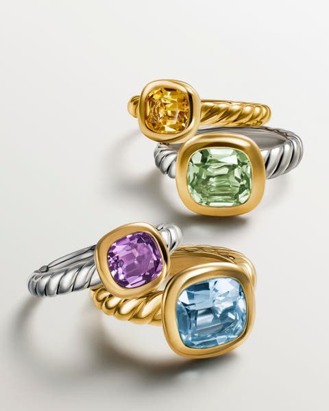 Silver and gold rings with a variety of colorful stones.