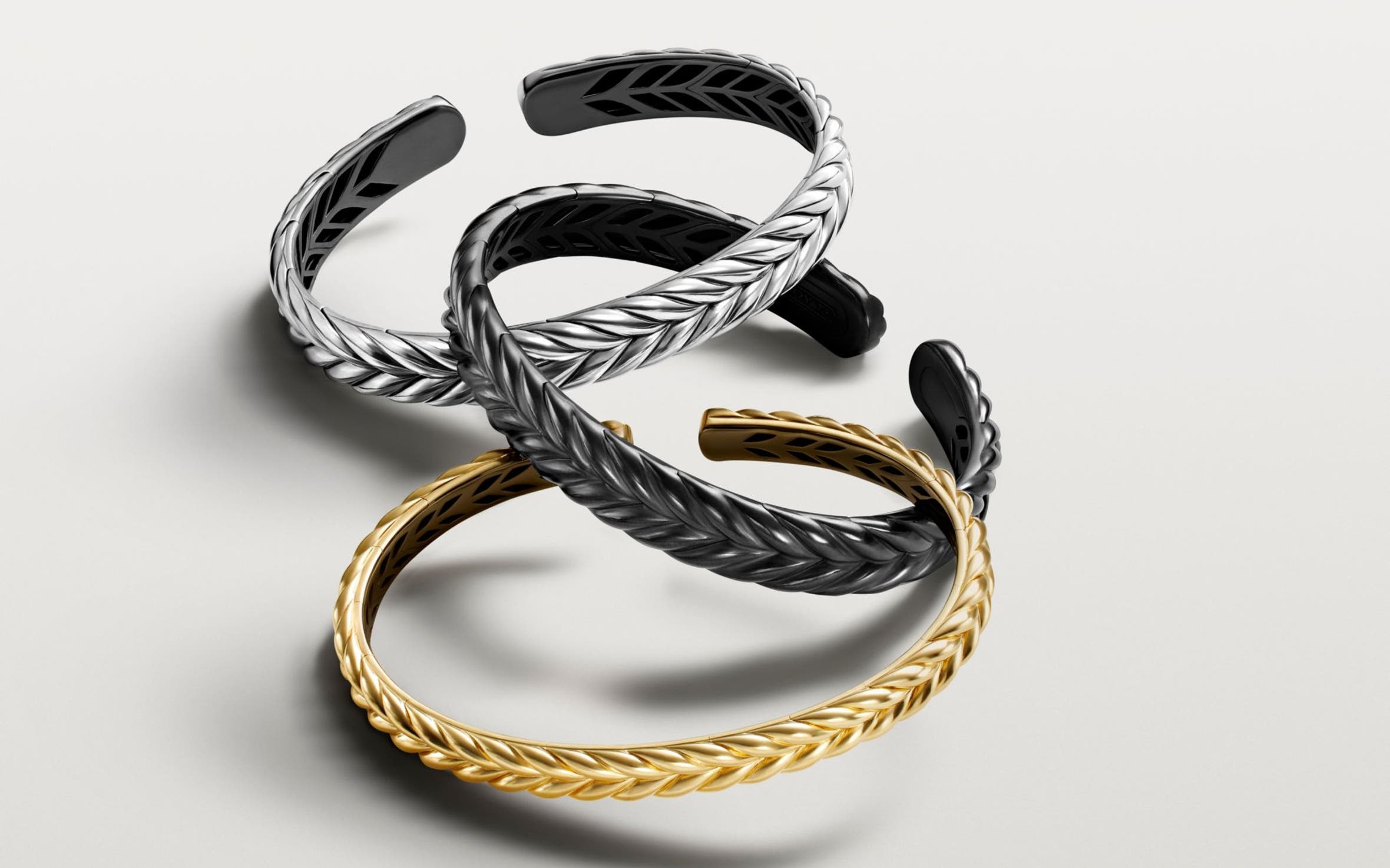 A silver, gold and black bracelet.