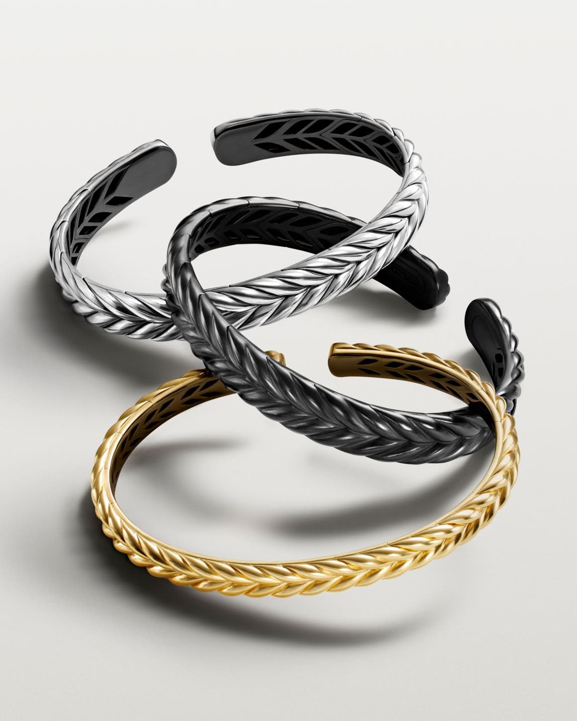 A silver, gold and black bracelet.