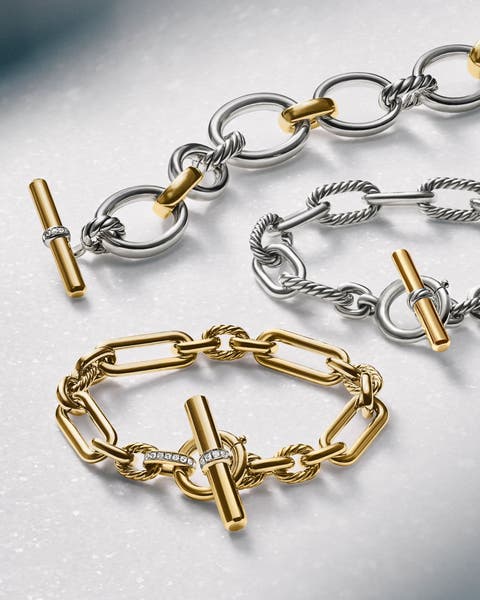 Link bracelets in silver and gold.