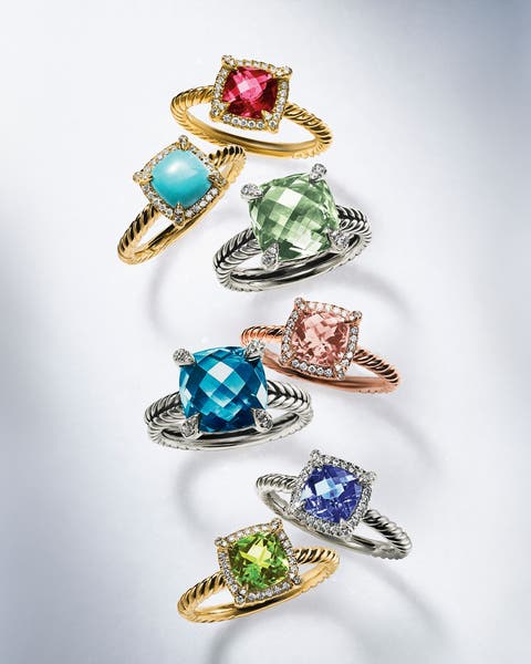 Silver and gold rings with a variety of colorful stones.