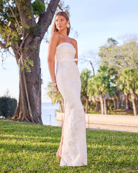 women in white strapless gown.