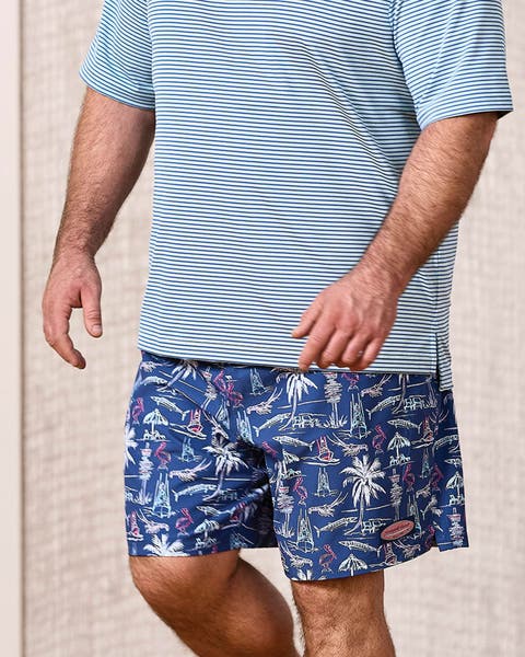 A man wearing patterned shorts.