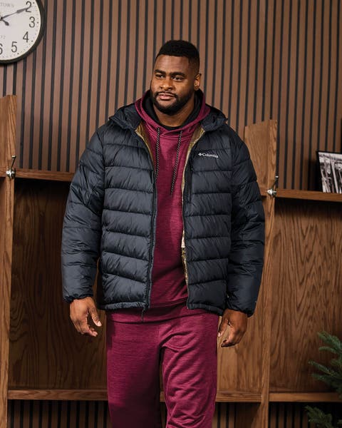 A man wearing a puffer jacket.