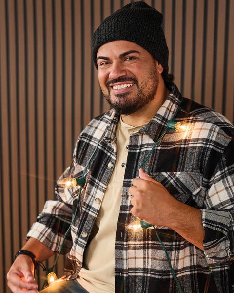 A man wearing a plaid shirt.