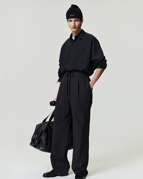 Man wearing Fear of God Essentials clothing.