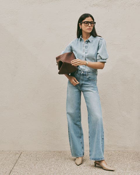 Woman wearing FRAME denim jeans and top.