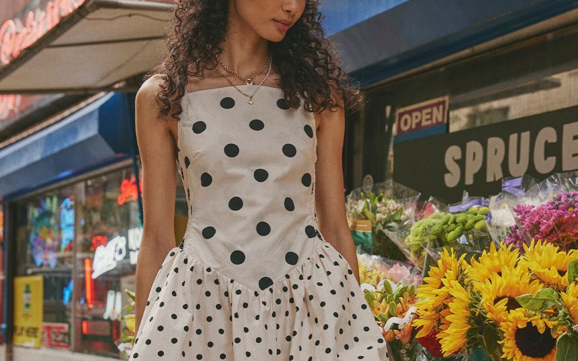 A woman wearing a polka dot bubble-hem minidress.