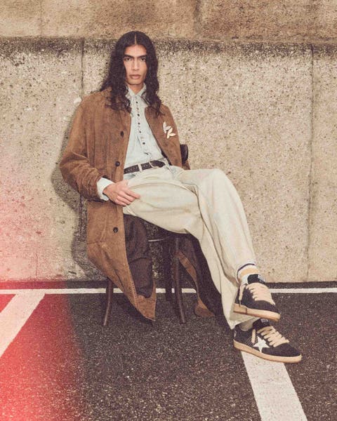 Man wearing Golden Goose clothing.