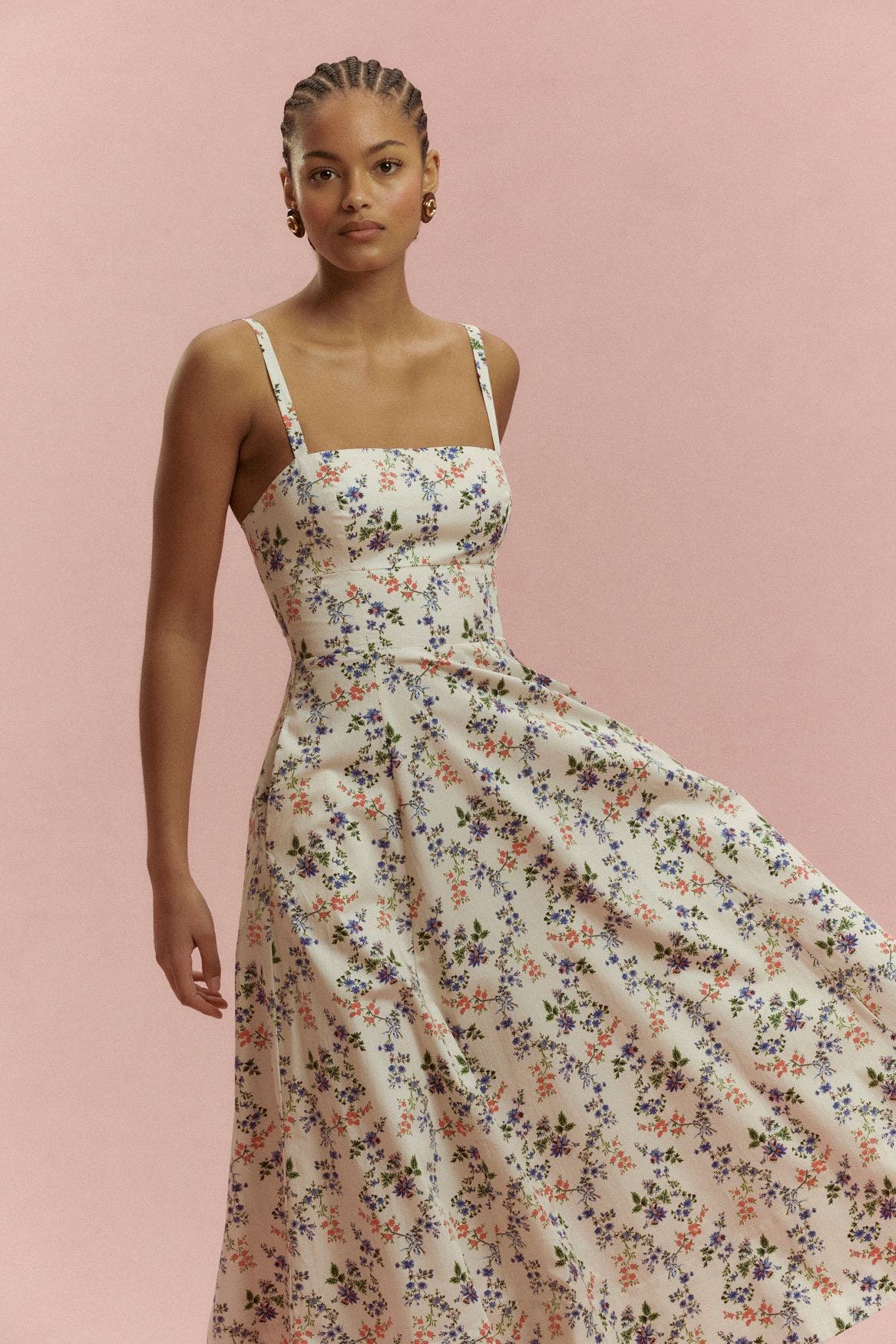 A woman wearing a floral dress.