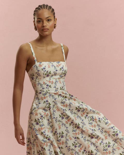 A woman wearing a floral dress.