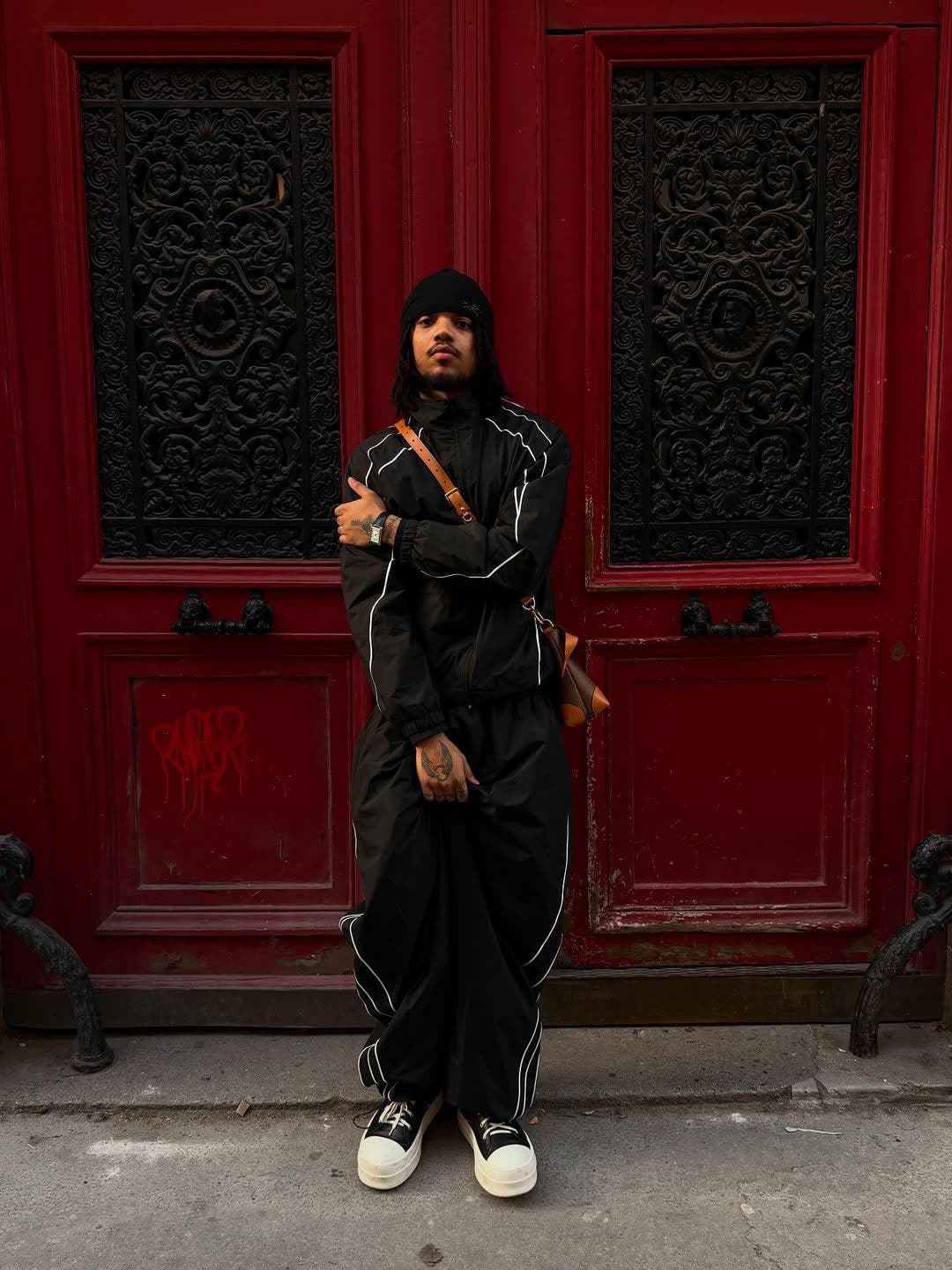 Man wearing black Jaded London tracksuit.