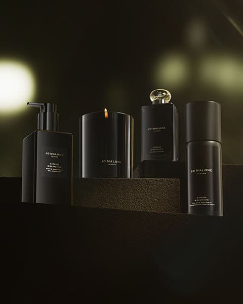 A group of four Jo Malone London products in scent Cypress & Grapevine.