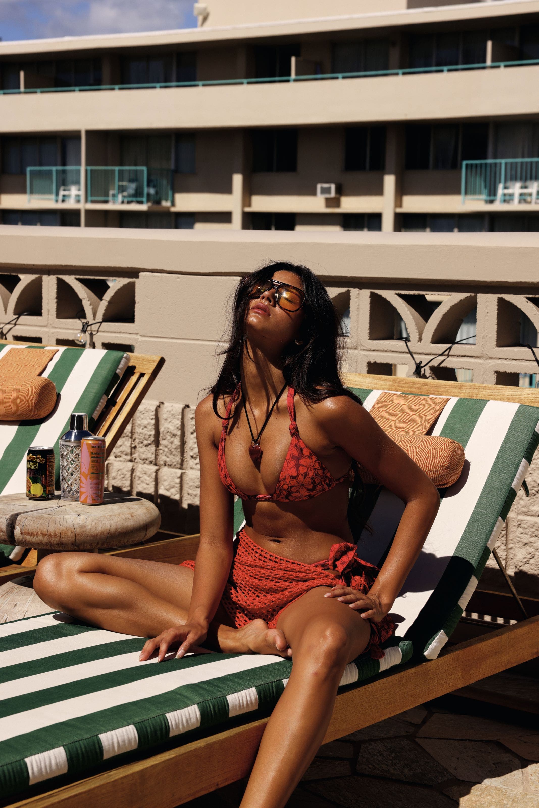 A woman wearing a bikini and sarong.