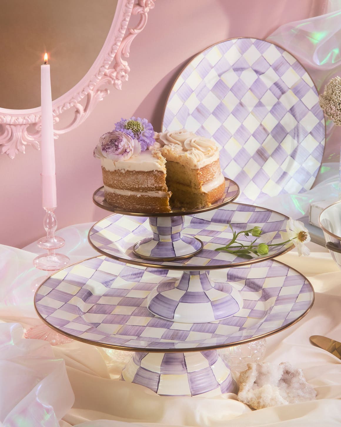 Cake stands and footed serving bowls in a lavender check pattern.