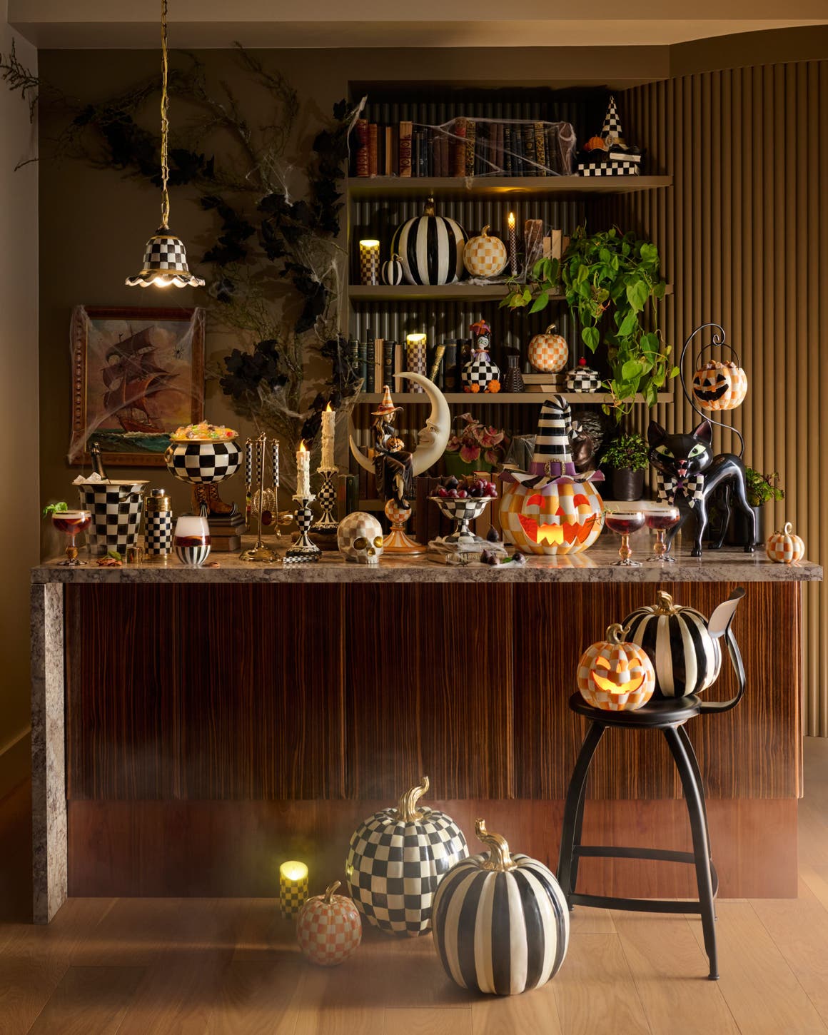 A tablescape of Halloween decorations from Mackenzie-Childs.