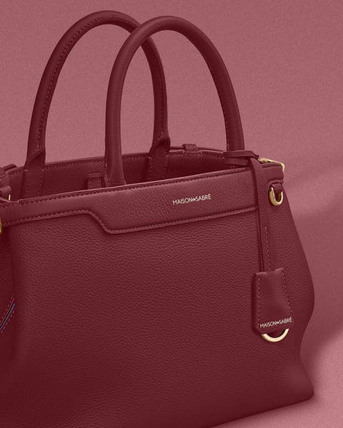 Maroon MAISON de SABRÉ leather bag.