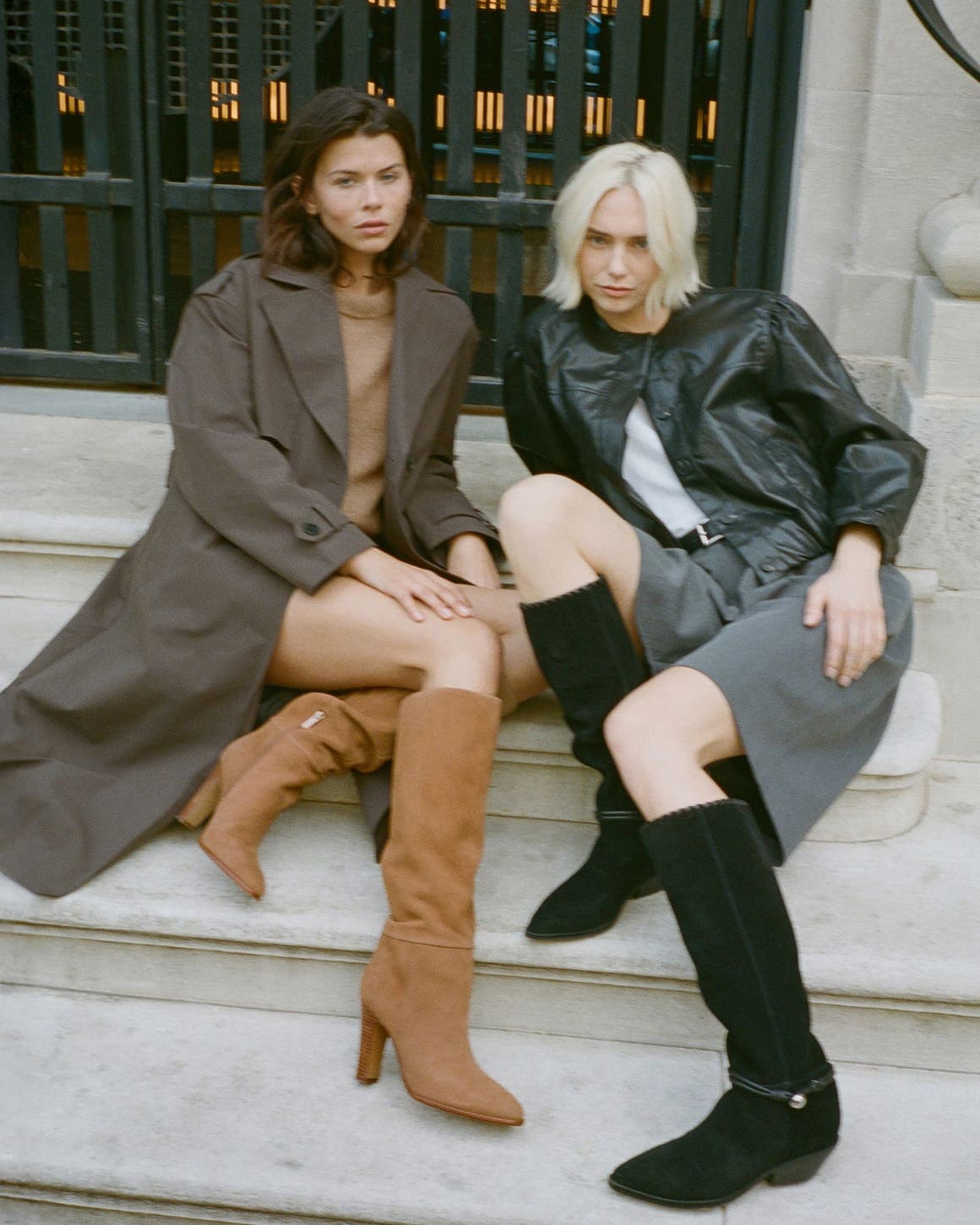 Two girls sitting on the stairs in brown and black suede knee high boots
