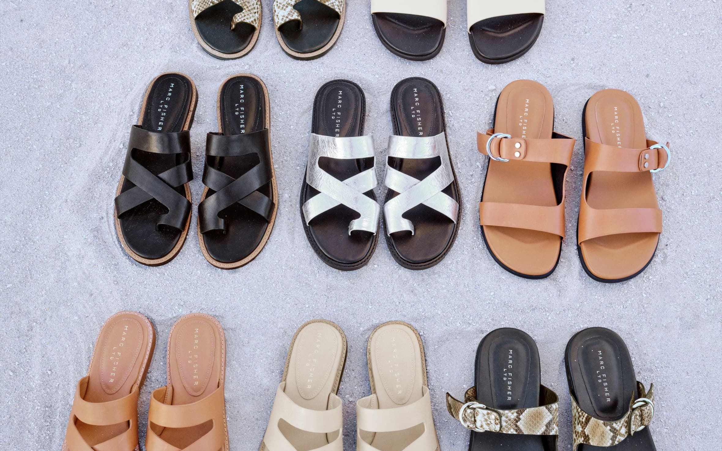 An assortment of flat sandals in beige, tan, silver, black and animal print.